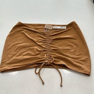 Skims Ruched Mini Swim Skirt.. Color Almond .. Size M NWT